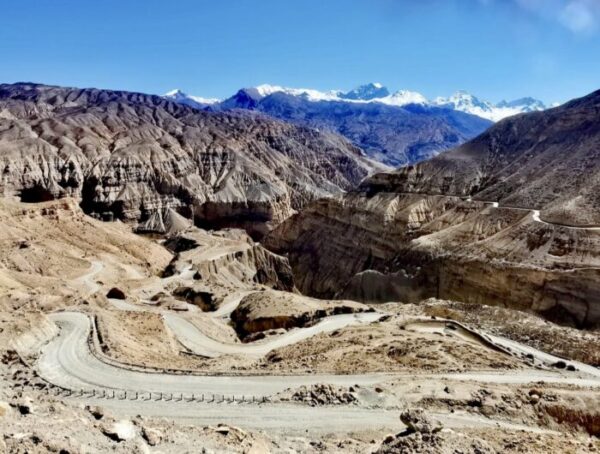 Winding mountain road across a serpentine pass in Upper Mustang, Nepal.