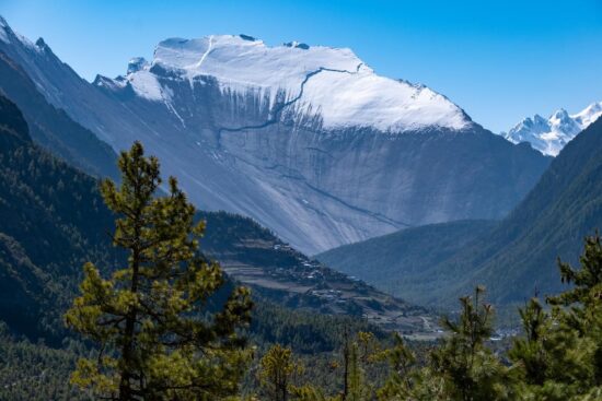 Stunning Himalayan mountain panorama seen during an adventure tour to Manang, Nepal, showcasing snow-capped peaks and high-altitude terrain.