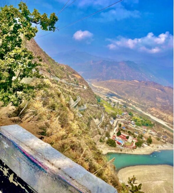 Serpentine mountain asphalt to Bardibas on the 5 days Everest gateway to Chitwan park motorcycle tour loop.