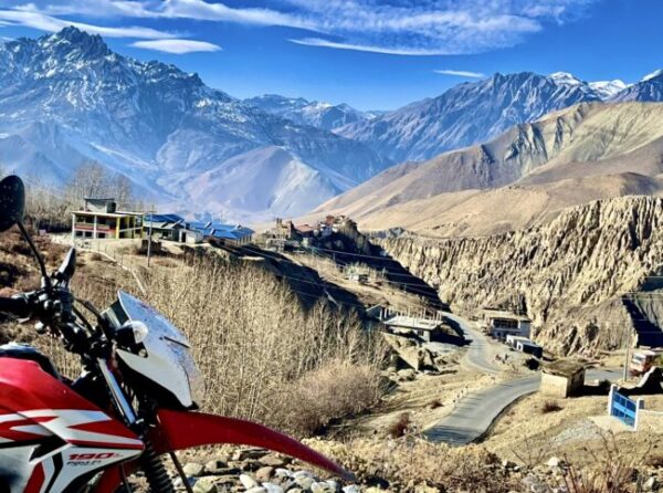 Honda XR190 dual-sport dirt bike parked at Muktinath during a Muktinath motorcycle tour in Nepal.