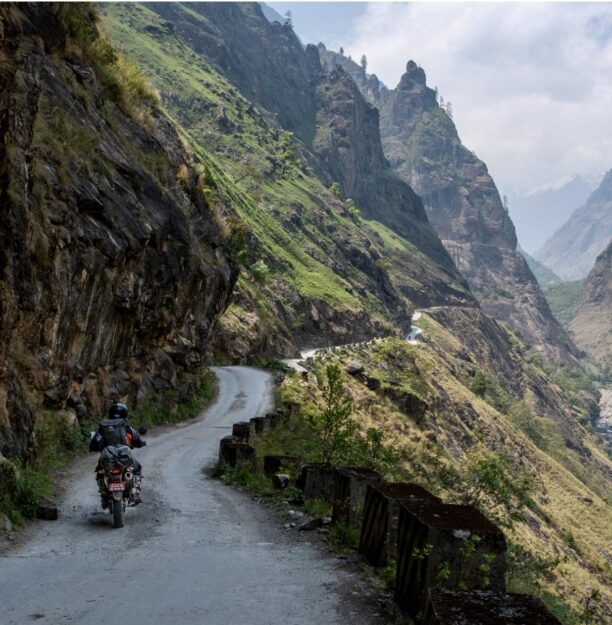 A rider following a narrow trail between Manang and Chame Nepal
