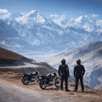 Riding through the high-altitude Korala border pass in Upper Mustang, Nepal, a remote destination on a Himalayan adventure motorcycle tour.
