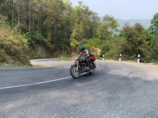 A rider descending Thankot Naubise road towards Pokhara.