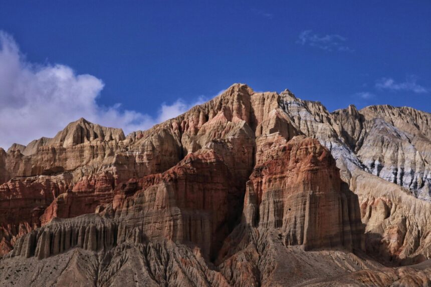 Explore the remote Himalayan desert of Upper Mustang, surrounded by dramatic mountains and timeless terrain.